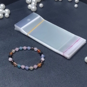 Zamykane torby z taśmą maskującą i otworem do zawieszania. Rozmiar 50 x 100 mm + 20 mm